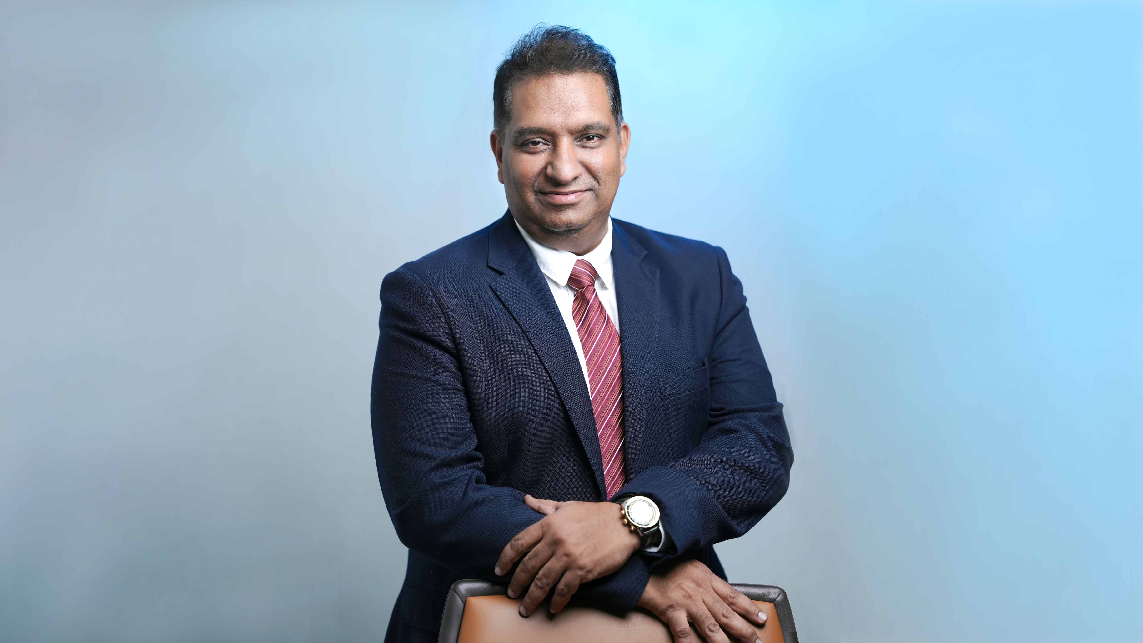 Portrait of Dinesh Ramchand, Managing Director of RG Group, leading real estate and investment projects in Dubai
